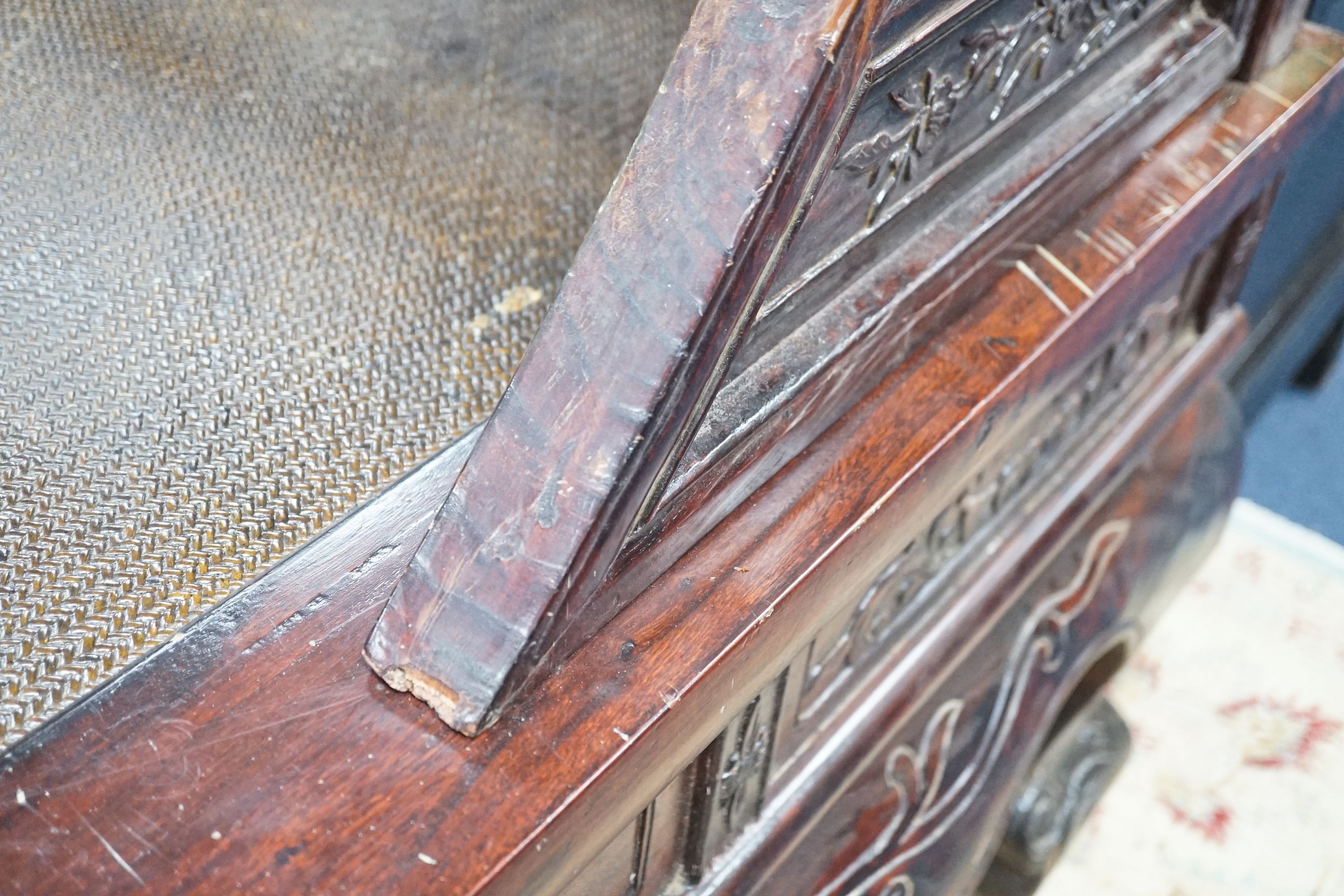 A Chinese carved elm opium bed, width 160cm, depth 207cm, height 225cm